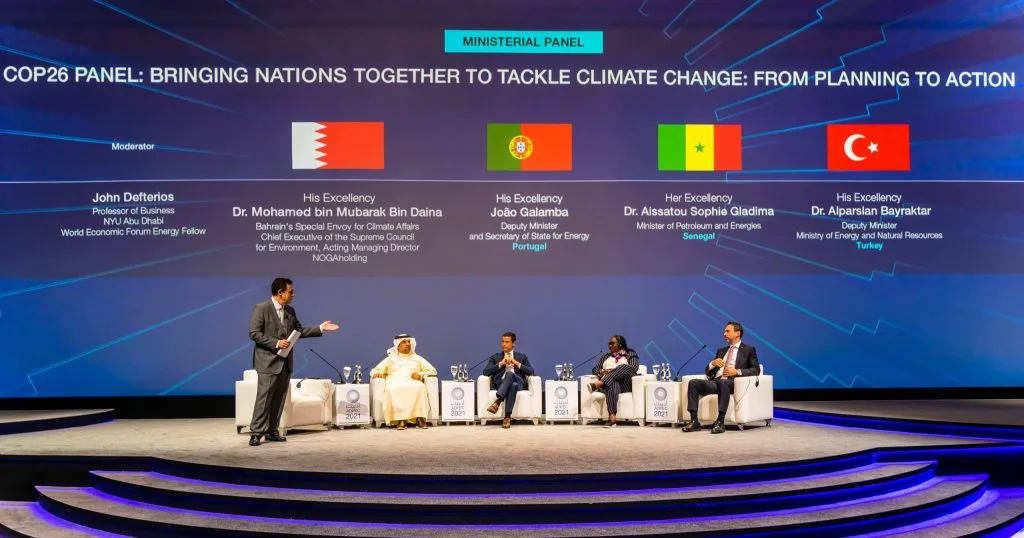 Four delegates seated on stage at COP26 ministerial panel discussion